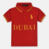 Child wearing a red polo shirt with 'Dubai' printed on it against a plain background