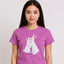 Person wearing a purple t-shirt with a cartoon rabbit design on a plain background