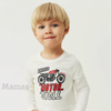Child wearing a white long-sleeve shirt with a motorcycle graphic and text on a light gray background.