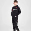 Person wearing a black tracksuit with 'Goodrich' branding on a white background