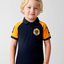 Child wearing a navy and yellow polo shirt with a logo on a light gray background