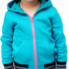 Child wearing a turquoise hoodie with pink zipper on a white background