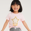 Child wearing a pink t-shirt with a star design on a white background