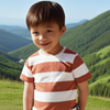 Child wearing a striped shirt standing in a scenic outdoor setting with green hills and blue sky.