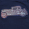 Child wearing a navy blue t-shirt with a vintage car design on a plain background