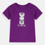 A purple t-shirt with a graphic of a cartoon llama wearing a sweater and the text 'BE AMAZING' printed on the front.