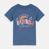 Child wearing a blue shirt with a rainbow design on a plain background