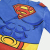 Child wearing a Superman costume on a white background