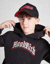 Person wearing a black 'Hood Rich' hoodie and pants with a red logo on a white background