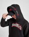 Person wearing a black 'Hood Rich' hoodie and pants with a red logo on a white background